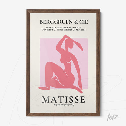 quadro com arte abstrata em tons de rosa representando figura feminina, moldura de madeira escura