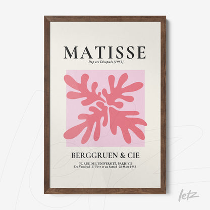 quadro com arte moderna de folhas em rosa sobre fundo rosa claro, moldura de madeira escura