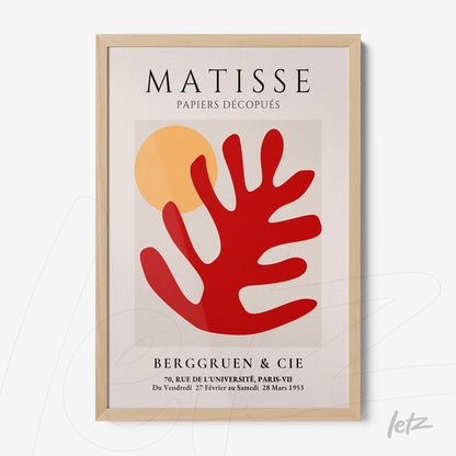 quadro decorativo com arte abstrata em tons de vermelho e amarelo, moldura de madeira clara, com design inspirado em Matisse