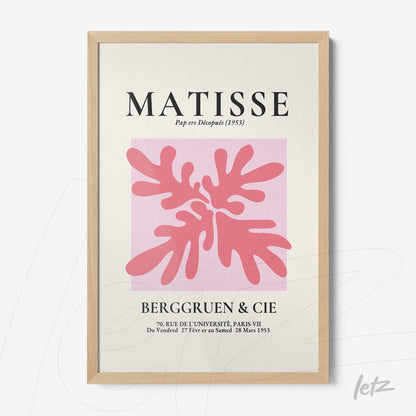 quadro com arte em estilo moderno de folhagens rosa claro sobre fundo rosa e texto decorativo, moldura de madeira clara