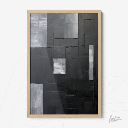 quadro abstrato em tons de preto, cinza e branco, com moldura de madeira clara