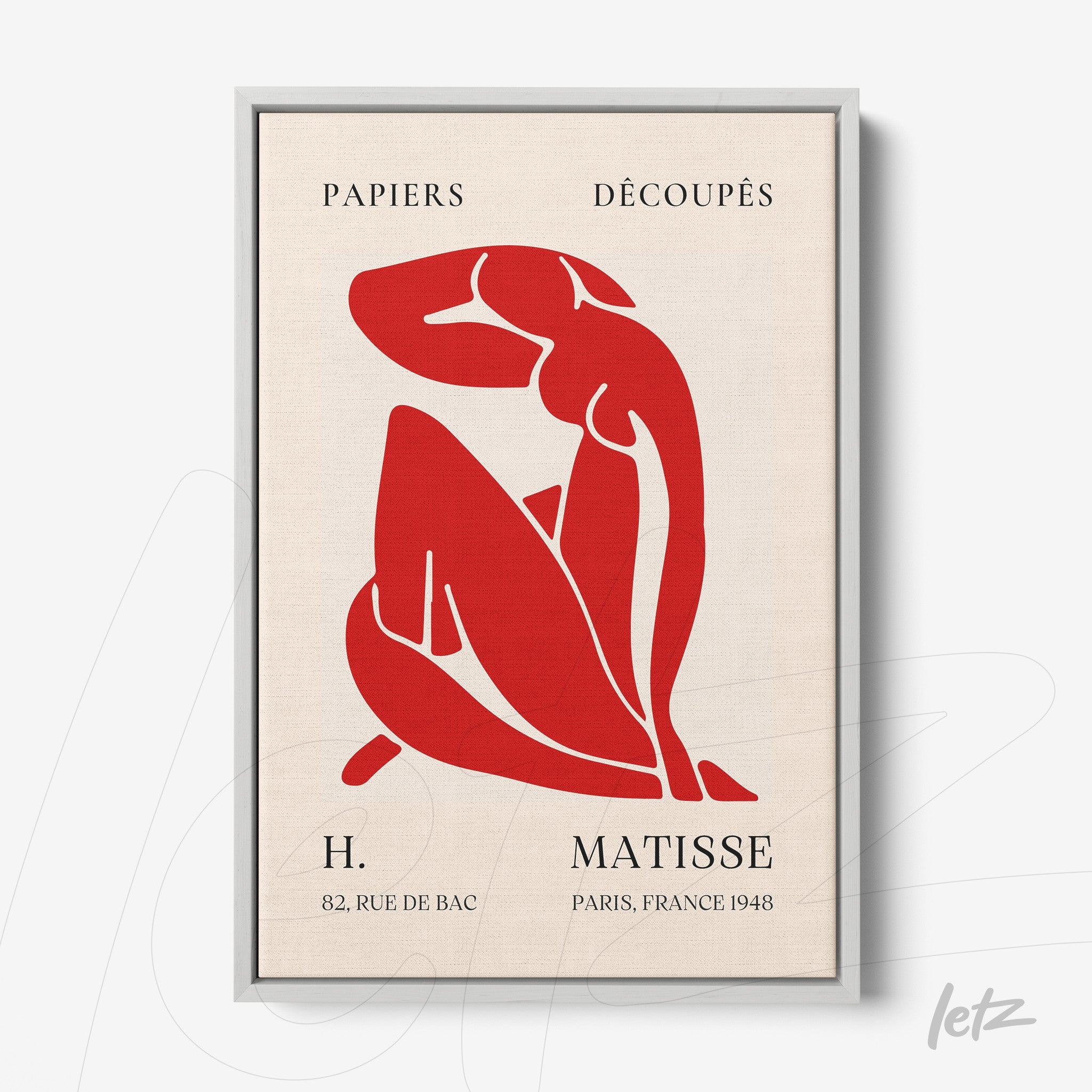 quadro com arte recortada de figura feminina em vermelho sobre fundo claro, moldura prata