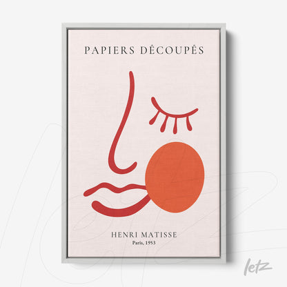 quadro com arte de desenho minimalista de rosto em tons de vermelho e rosa com moldura prata