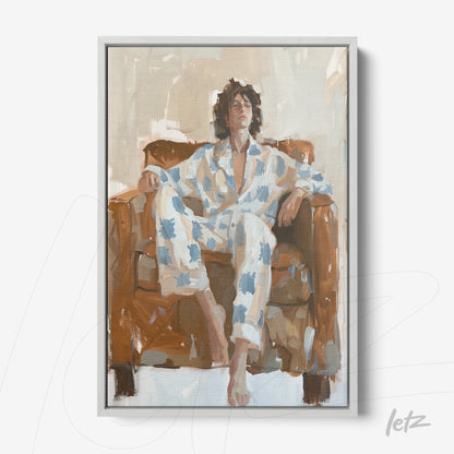 quadro com arte contemporânea de um homem relaxando em sofá, usando pijama estampado e moldura cinza