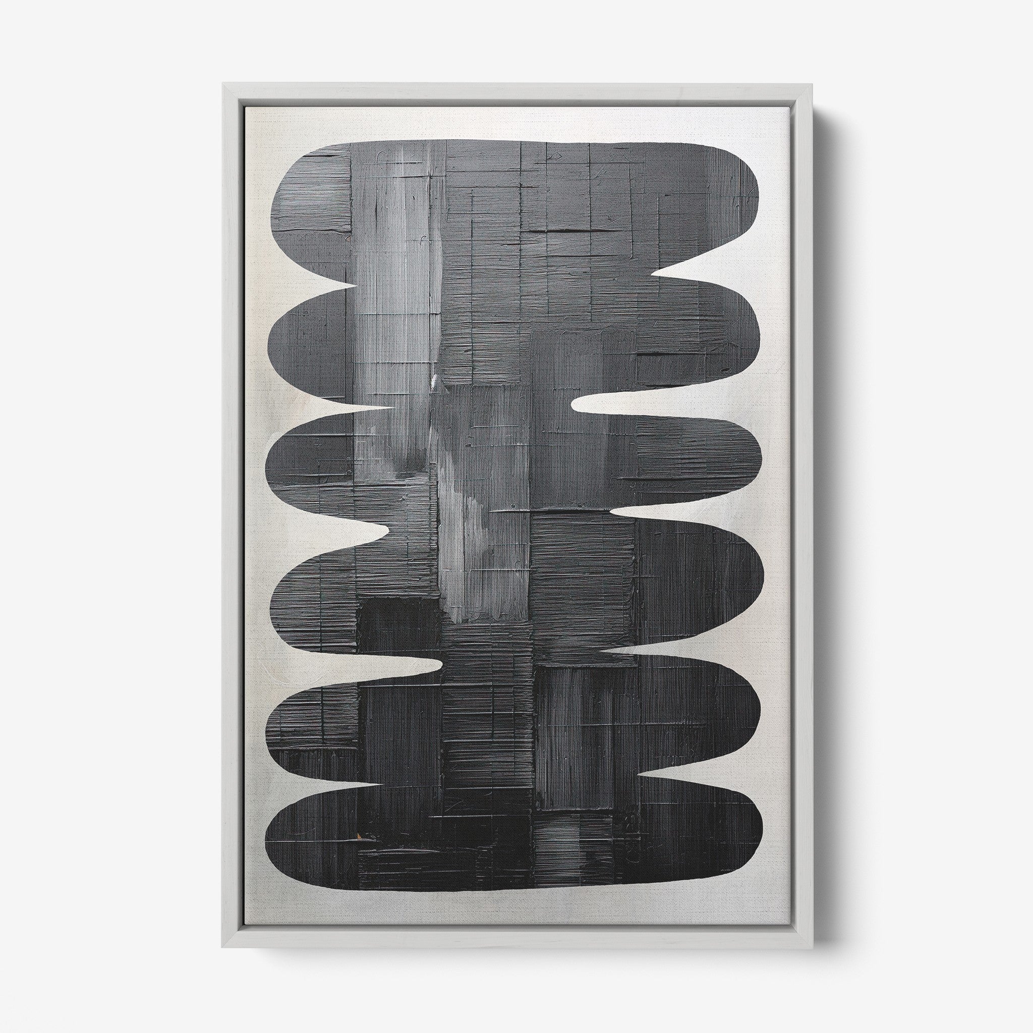 quadro com arte abstrata em tons de preto sobre fundo claro, emoldurado com moldura prateada