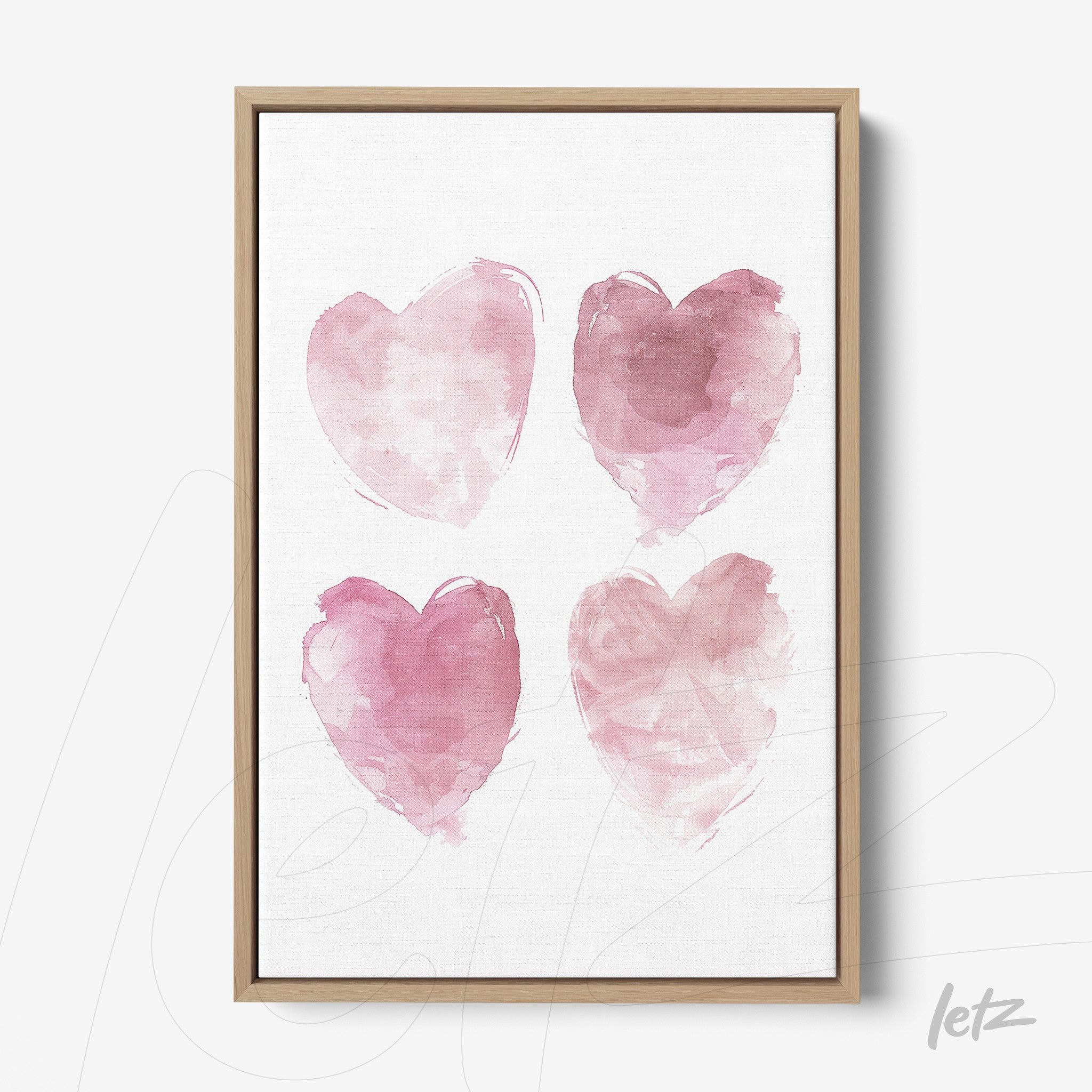 quadro com quatro corações em aquarela rosa em moldura de madeira clara
