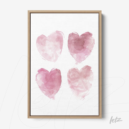 quadro com quatro corações em aquarela rosa em moldura de madeira clara