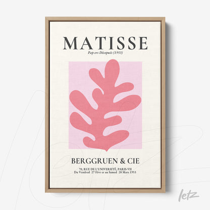 quadro com arte contemporânea em moldura de madeira clara, apresentando uma folha rosa com fundo pink e texto estilizado no topo