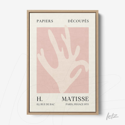 quadro com arte moderna de mão estilizada em fundo rosa claro, com moldura de madeira clara