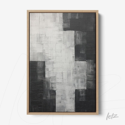quadro em canvas com arte abstrata em tons de preto, branco e cinza com moldura de madeira clara