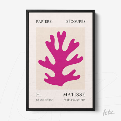 quadro com arte de recortes coloridos em rosa sobre fundo claro, moldura preta fina