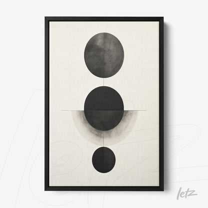 quadro em moldura preta com arte abstrata de círculos em tons de preto e cinza sobre fundo claro