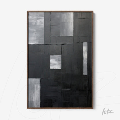 quadro em relevo com arte abstrata em tons de preto, cinza e prata, moldura de madeira escura