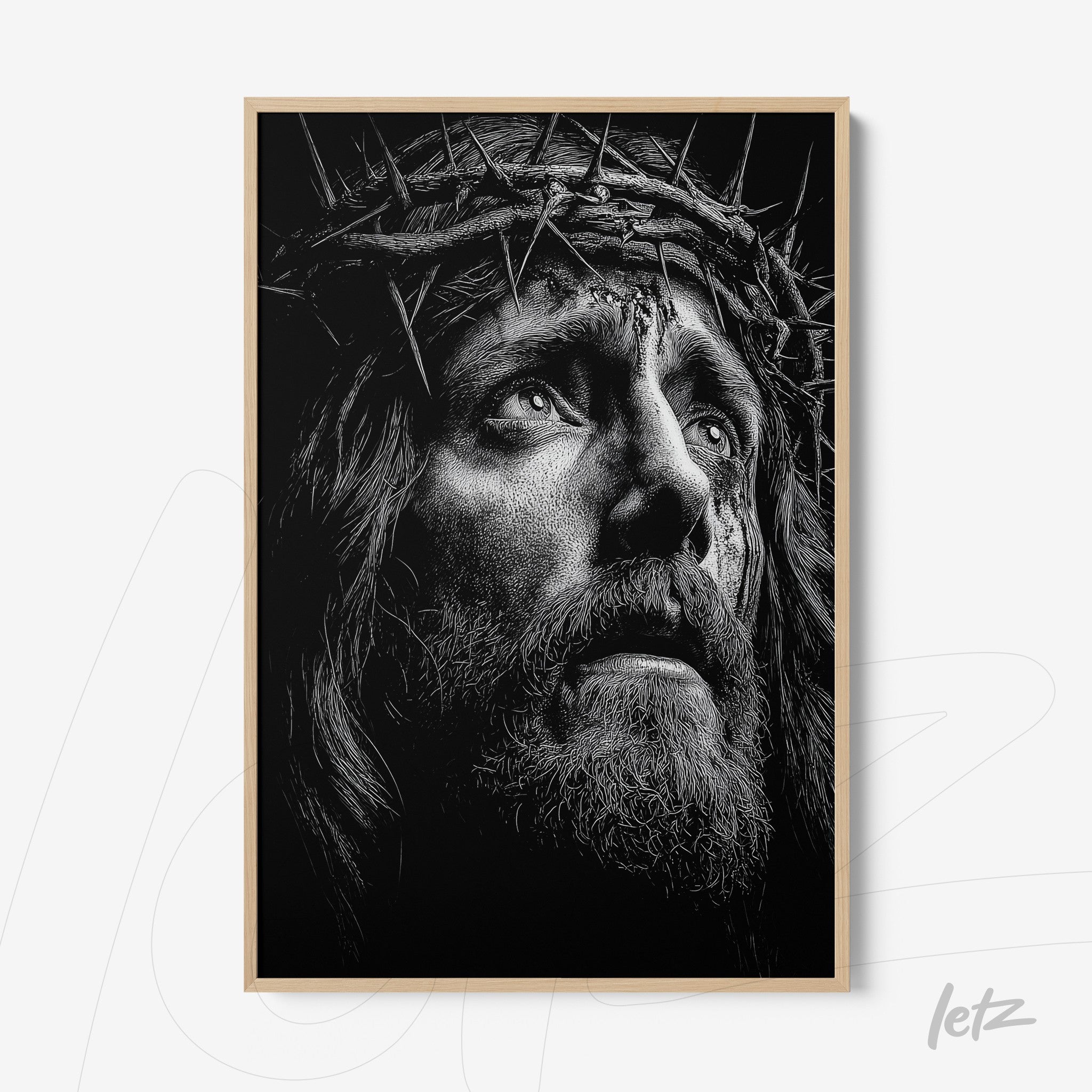 quadro em preto e branco retratando uma figura de Cristo com coroa de espinhos e expressão de dor em moldura clara