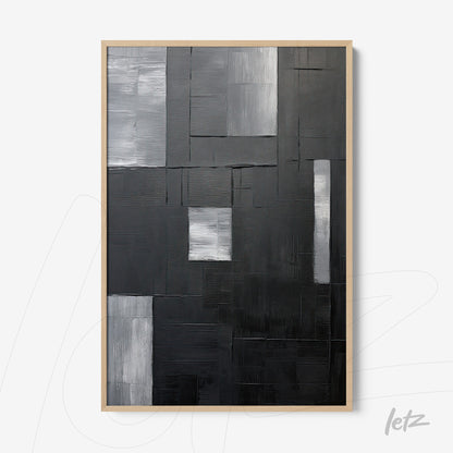 quadro abstracto em preto e branco com texturas variadas em moldura clara