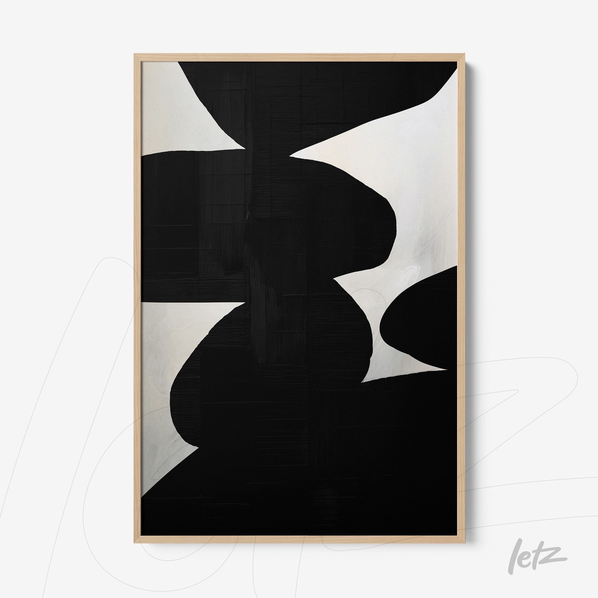 quadro com arte abstrata em preto e branco, exibido em moldura de madeira clara