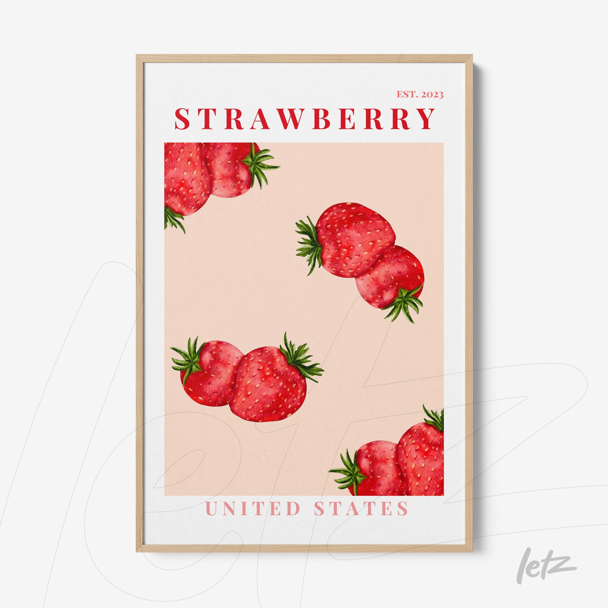 quadro com arte decorativa de morangos sobre fundo rosa em moldura clara