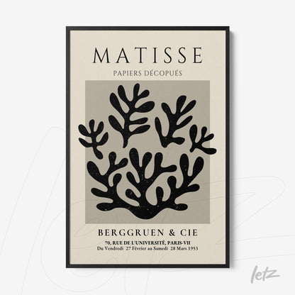 quadro decorativo com arte de folhas recortadas em preto sobre fundo cinza, moldura preta fina