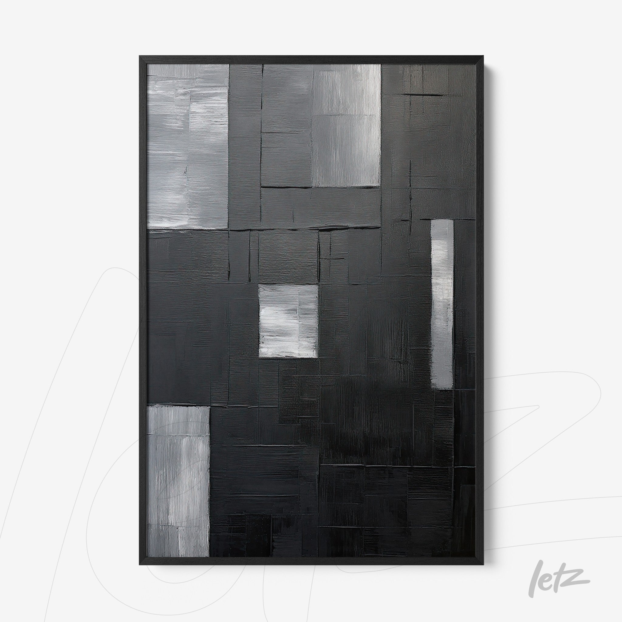 quadro abstrato em preto e cinza com várias texturas em moldura preta