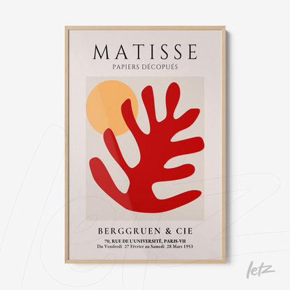 quadro com arte de Matisse em moldura de madeira clara, apresentando formas abstratas em vermelho e amarelo sobre fundo claro