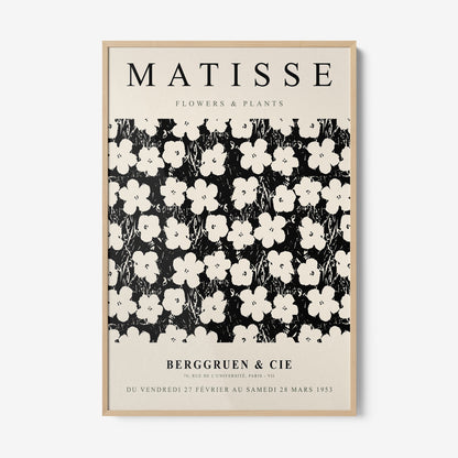 quadro com arte estilizada em fundo preto com flores brancas em design gráfico, em moldura clara