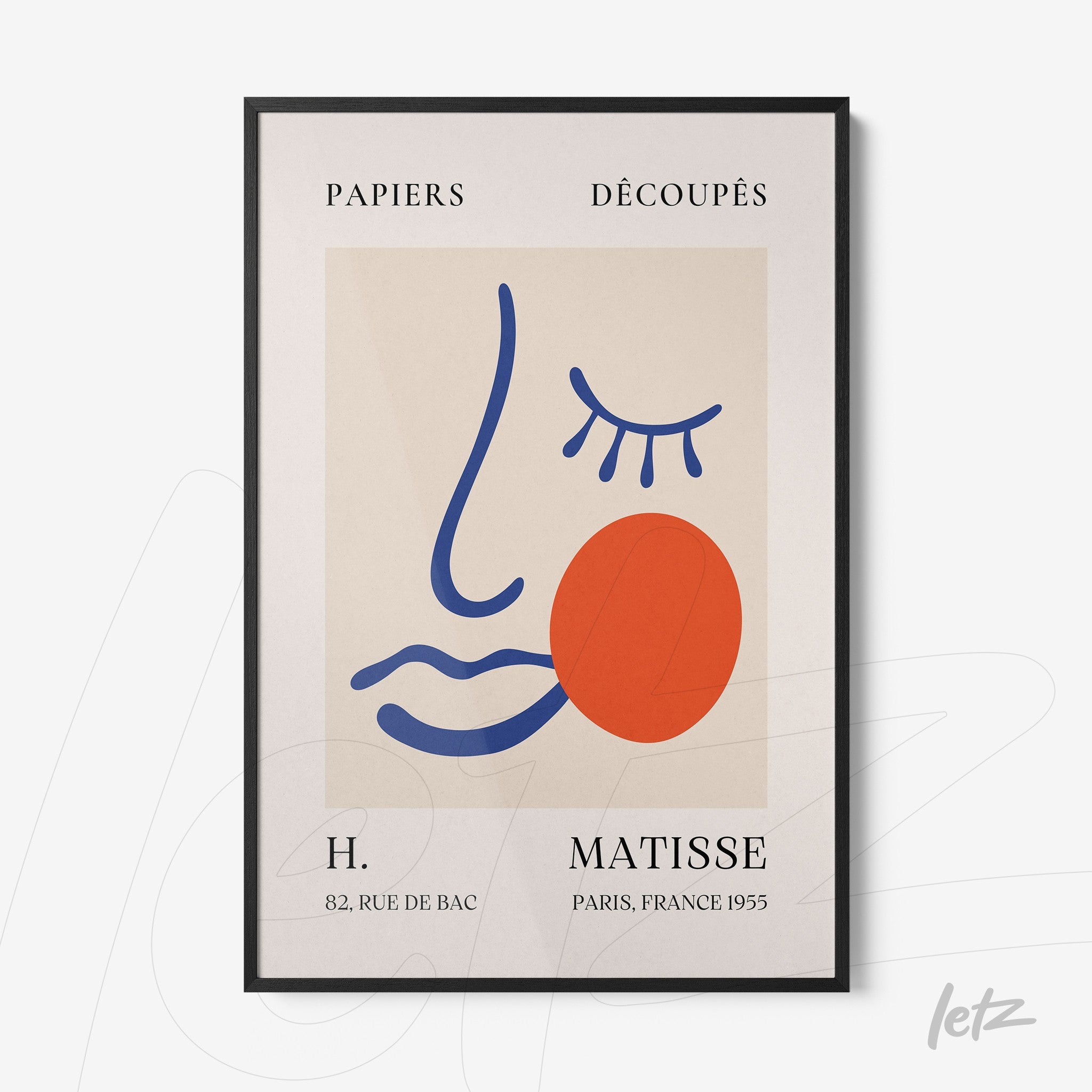 quadro com arte abstrata em moldura preta, destacando uma face estilizada em cores vibrantes com formas geométricas