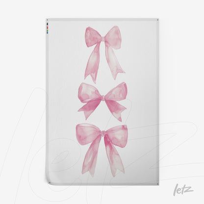 quadro com ilustrações de laços rosa em fundo branco